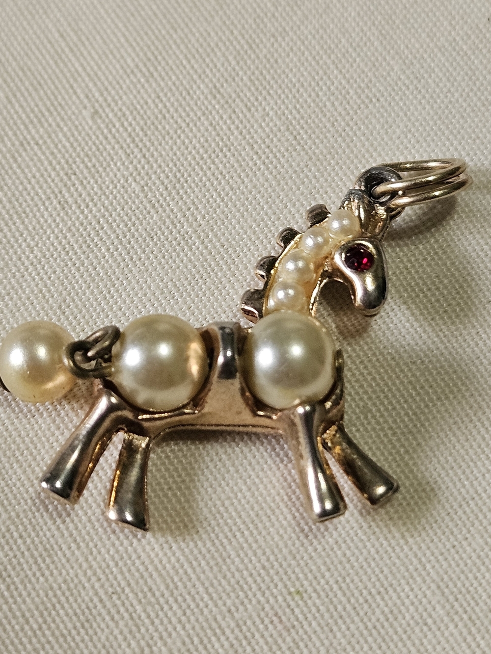 Gold Tone Horse Pendant with Faux Pearls and Red Rhinestone Eye